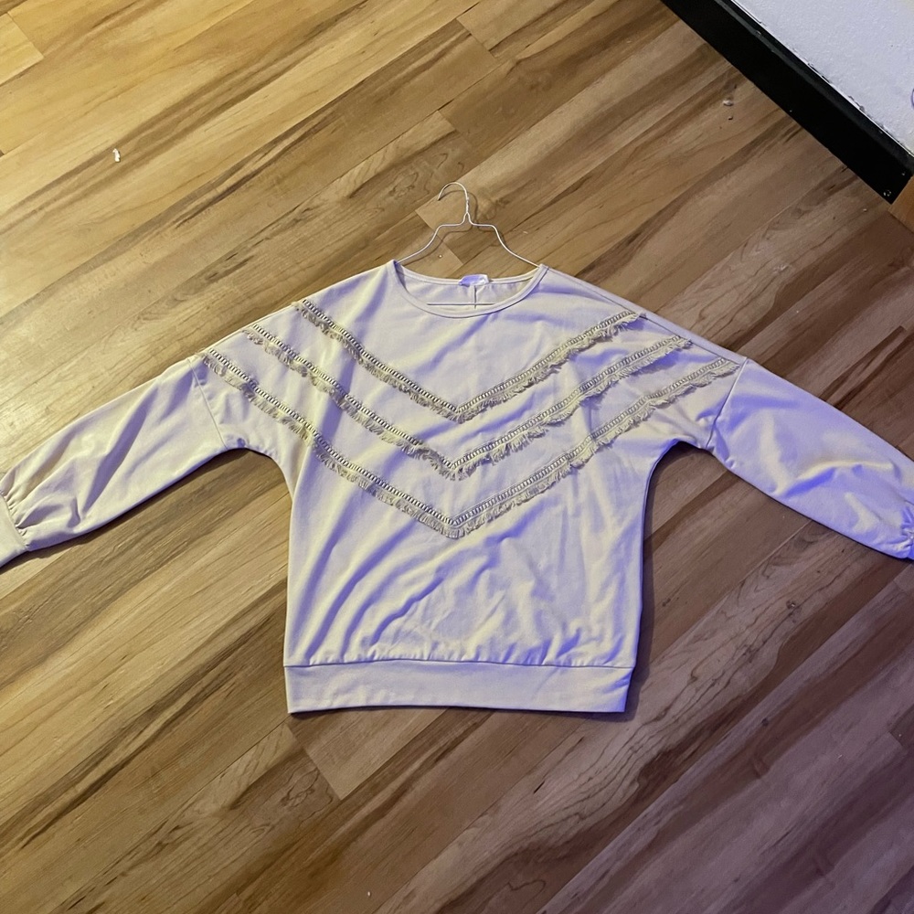 Cream colored crewneck.